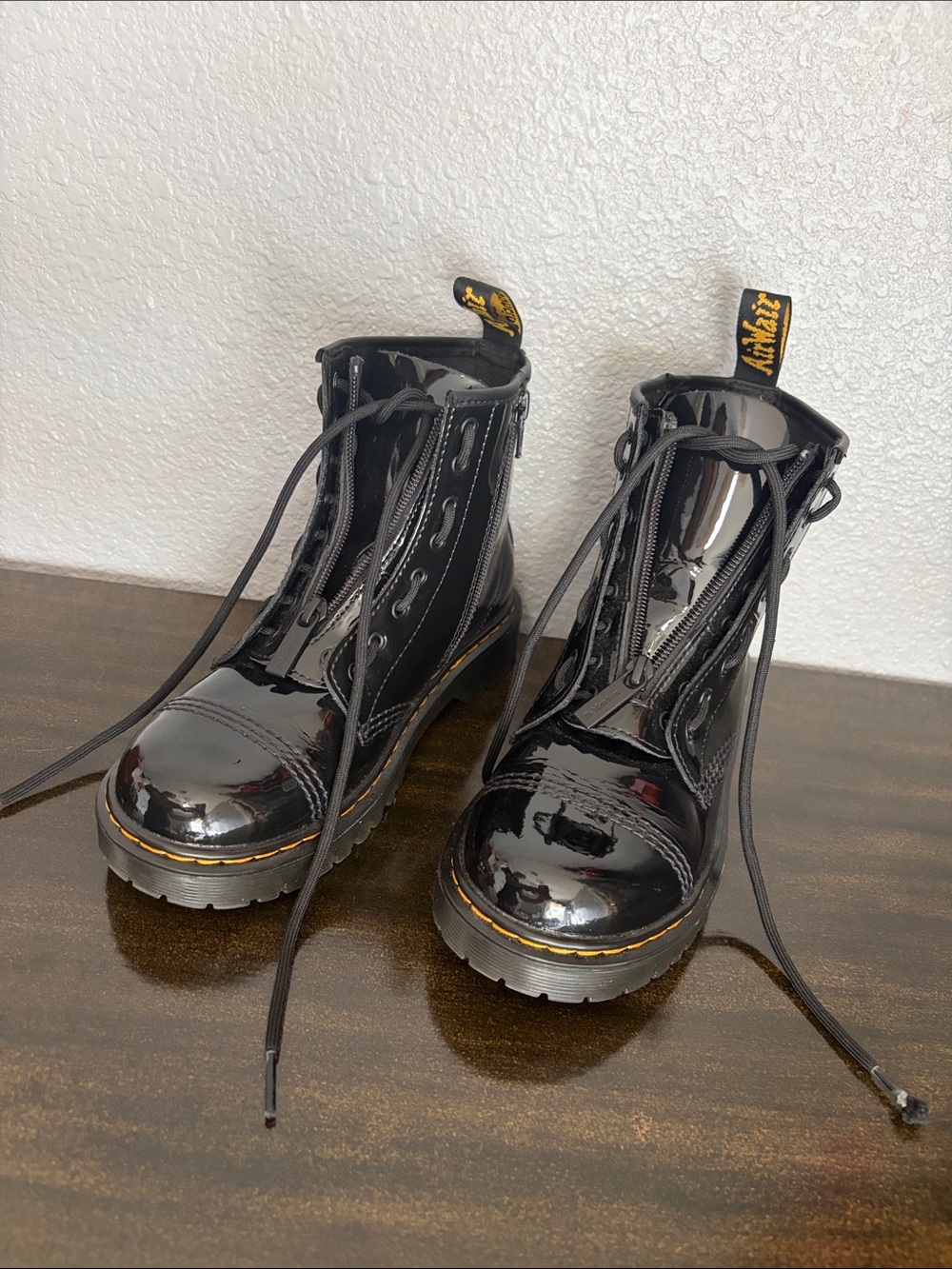 Dr. Martens Black Patent Lace-Up Combat Boots with Yellow Heel Loop